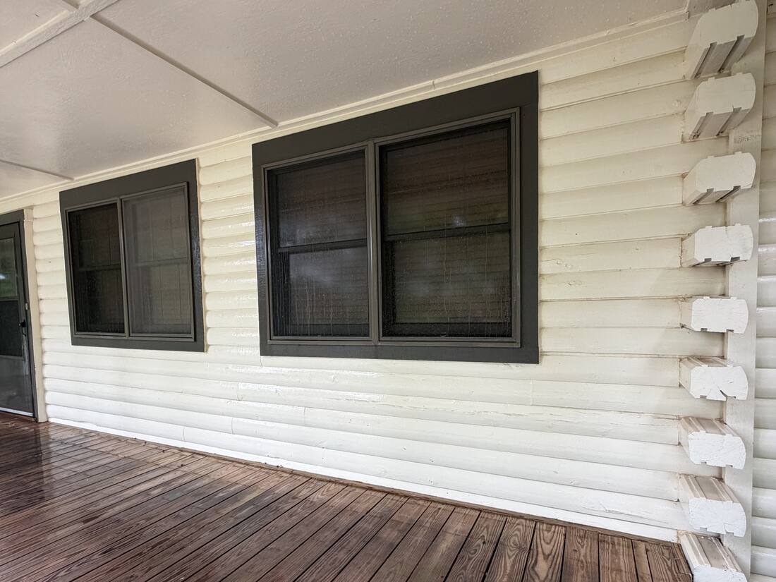 Log home siding after soft washing, clean and bright