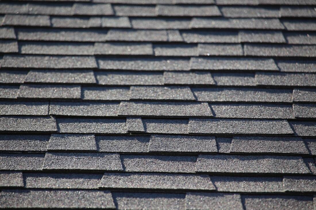 A residential roof cleaned by soft washing